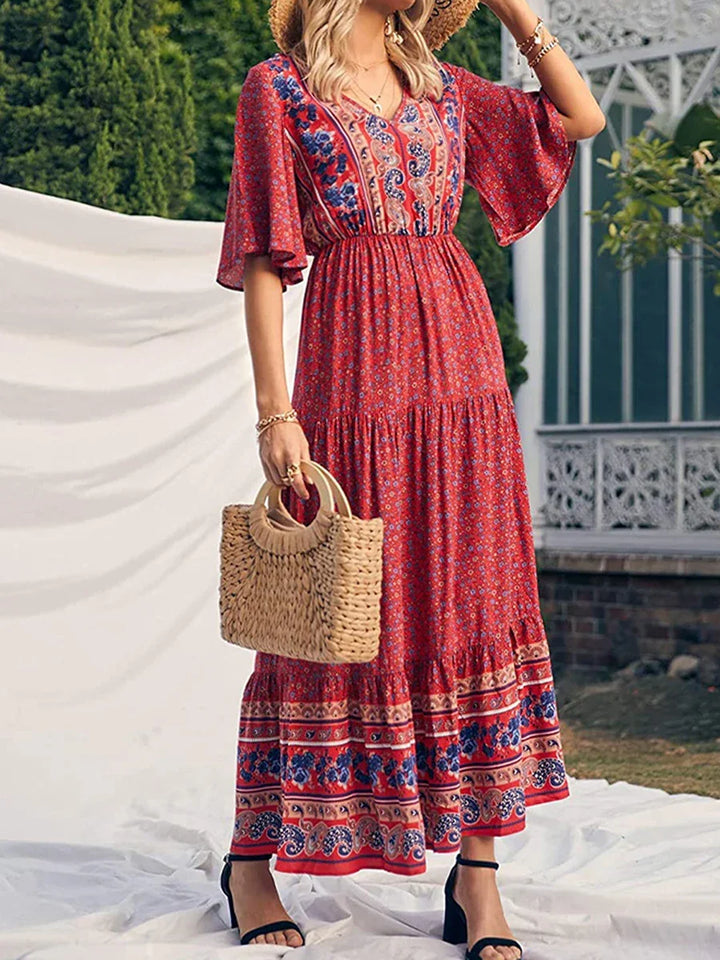 Flowy boho print summer dress for women, elegant and casual beach style, V-neck design.