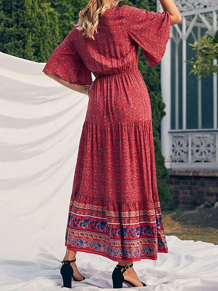 Elegant women's boho summer dress with a vibrant print, V-neck, and comfortable short sleeves.
