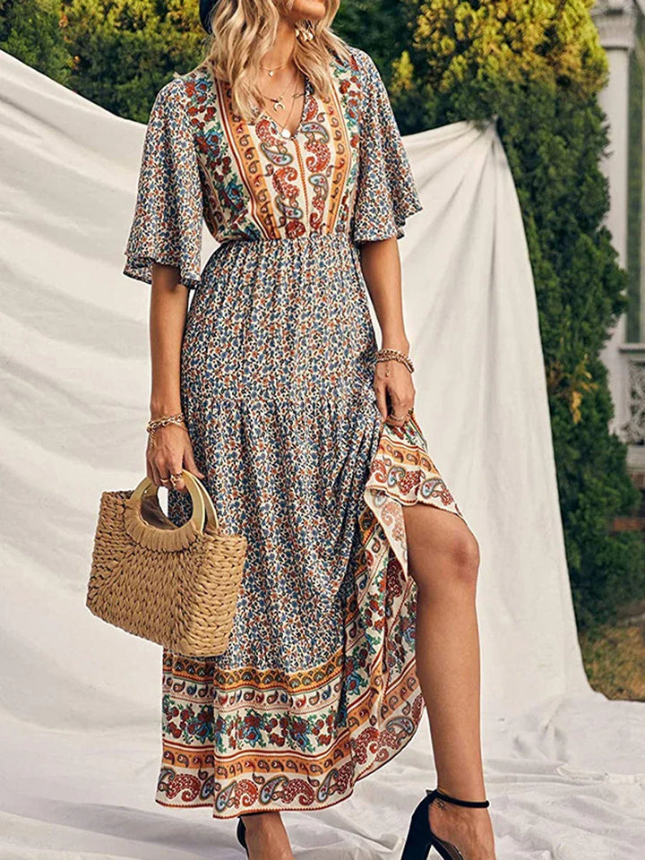 Flowy women's boho summer print dress with V-neck, perfect for elegant casual or beach outings.