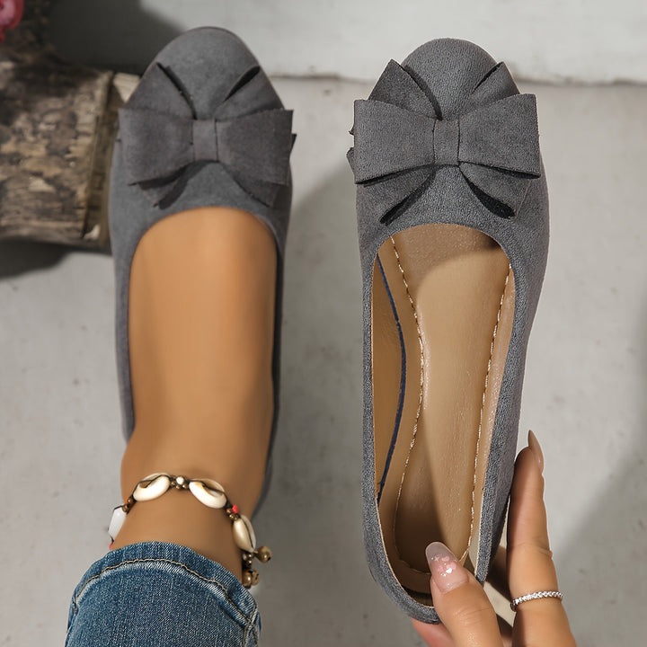 Red women's casual wedge ballet flats with a round toe and bow, easy slip-on style.