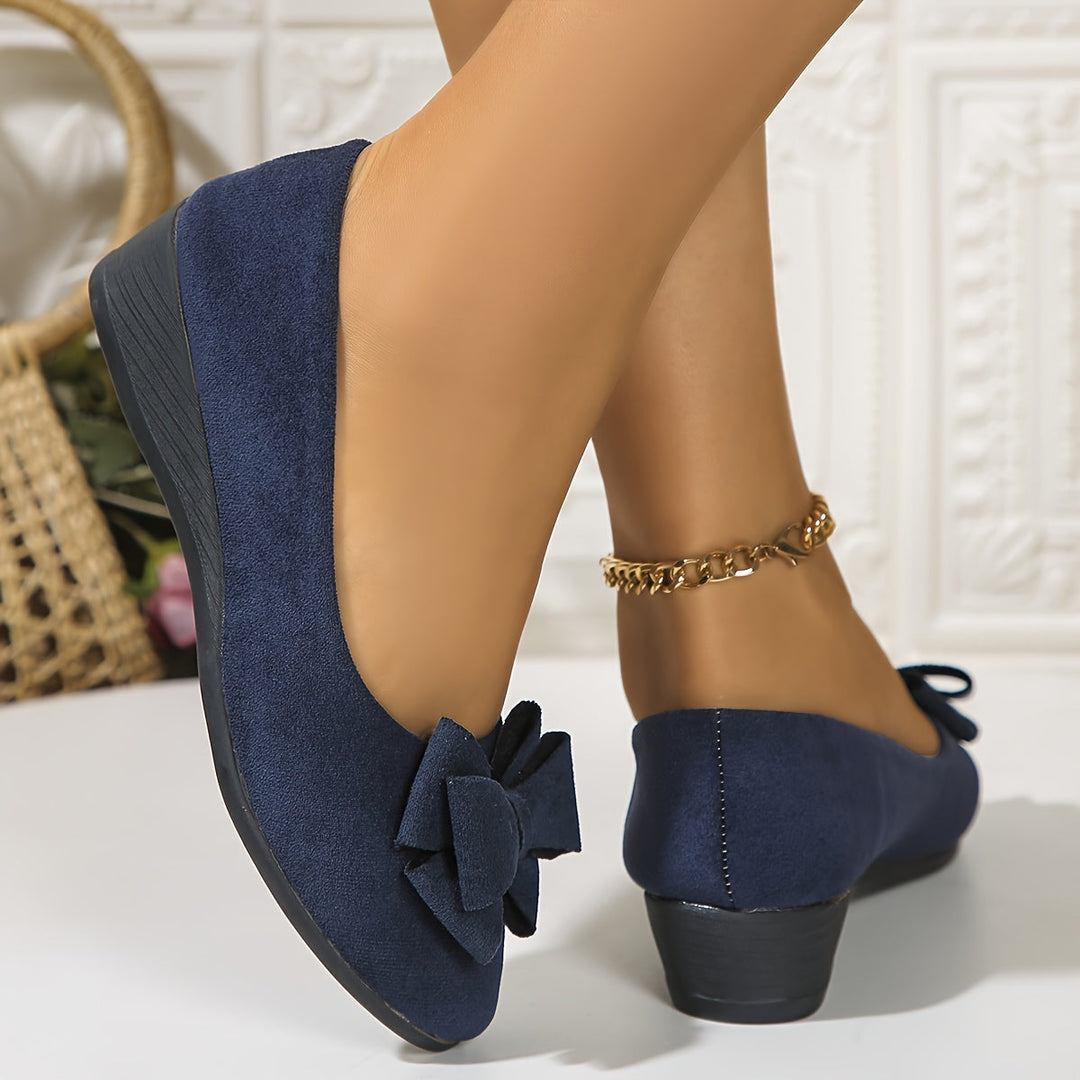 Women's feminine bow accent wedge ballet flats, round toe, comfortable slip-on style.