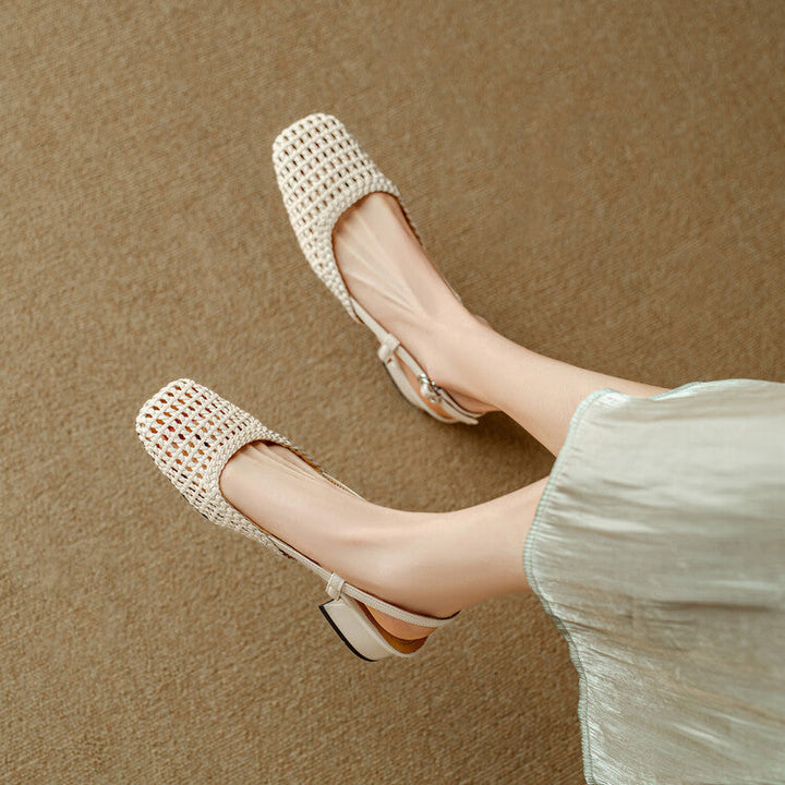 Close-up of elegant women's braided sandals with a slingback strap & sturdy block heel.
