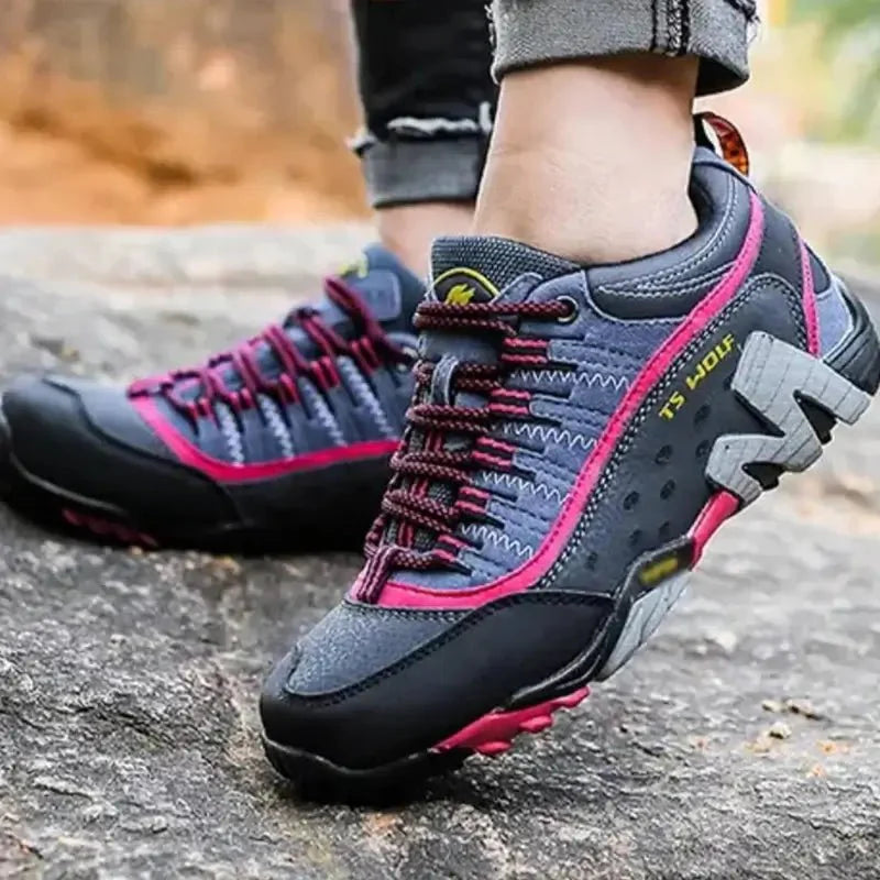 Women's breathable outdoor hiking shoes with strong grip on a rocky trail