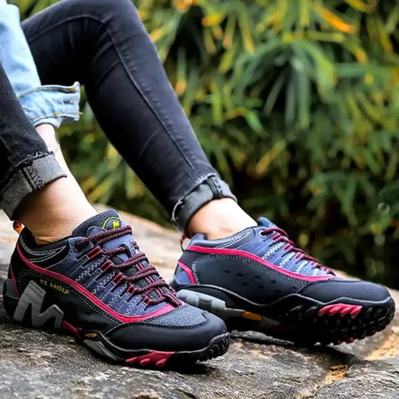 Side view of women's hiking shoes, highlighting breathable fabric and robust sole