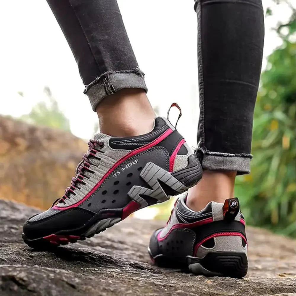 Woman wearing breathable hiking shoes, walking on an outdoor trail for fitness