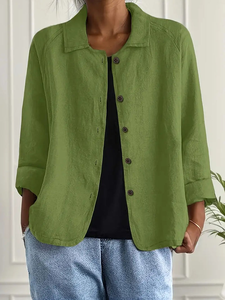Women's button-front relaxed fit top, styled for a casual everyday look. Three-quarter sleeve, work leisure.