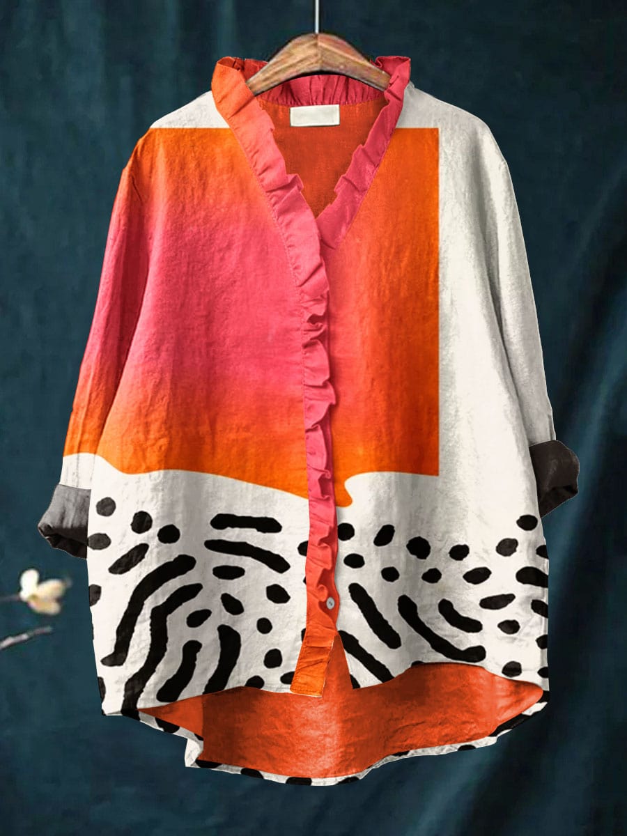 Women's casual button-up blouse with abstract block pattern. Relaxed fit, V-neck, long sleeve top for stylish daytime wear.
