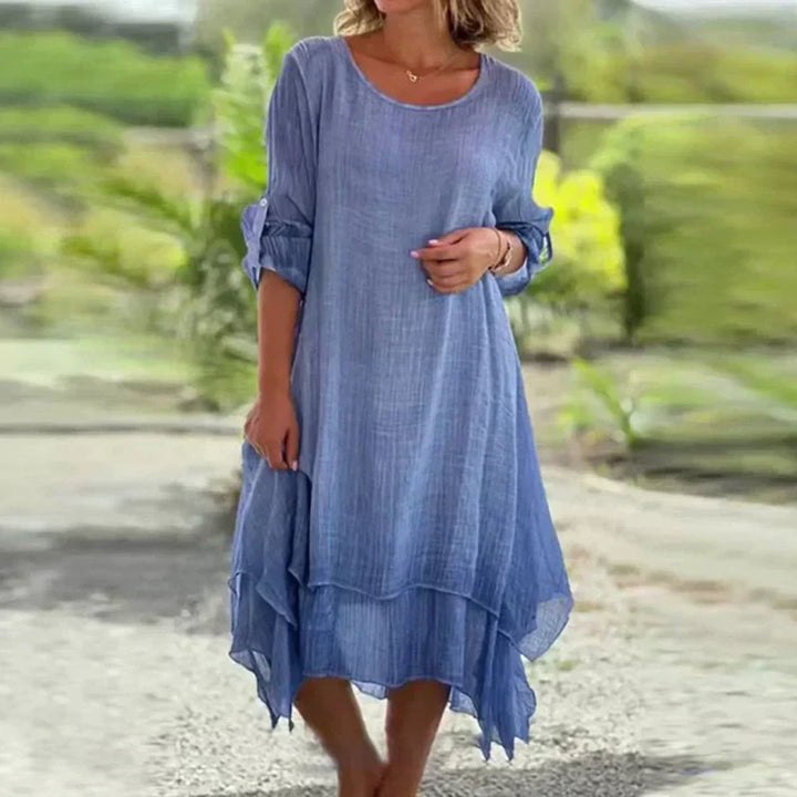 Chic pink women's layered midi dress. Relaxed fit, 3/4 sleeve summer style for comfortable everyday wear.