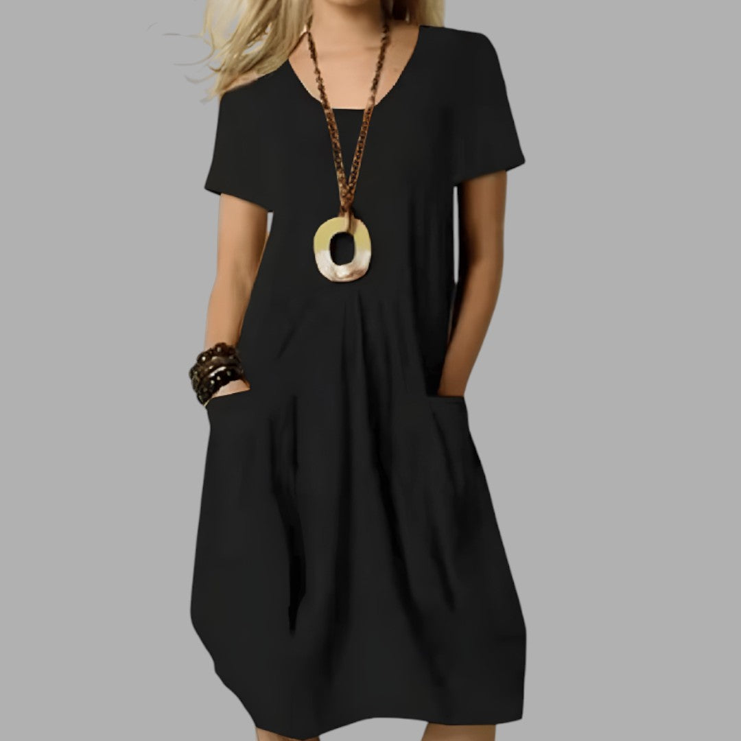 Comfortable women's midi dress, perfect casual attire. Effortless, flattering fit for versatile summer & everyday fashion.
