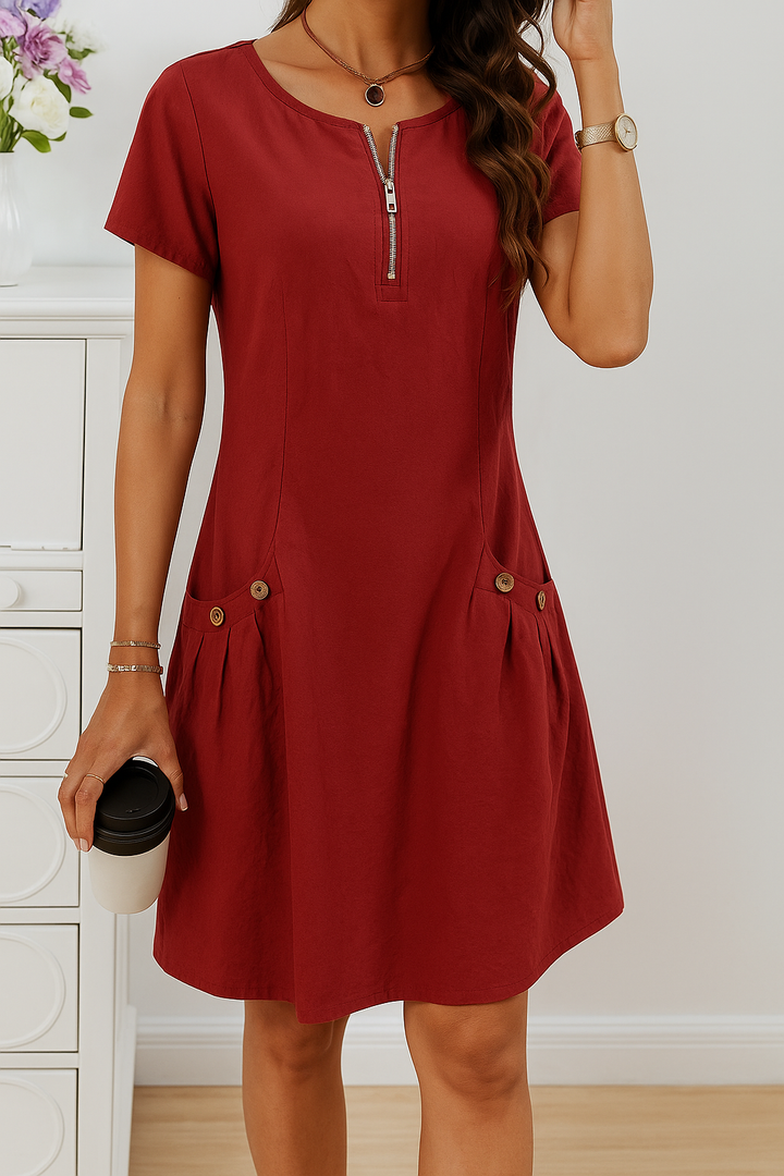 Versatile women's casual midi dress with a practical zip front, short sleeves, and pockets, great for everyday style.