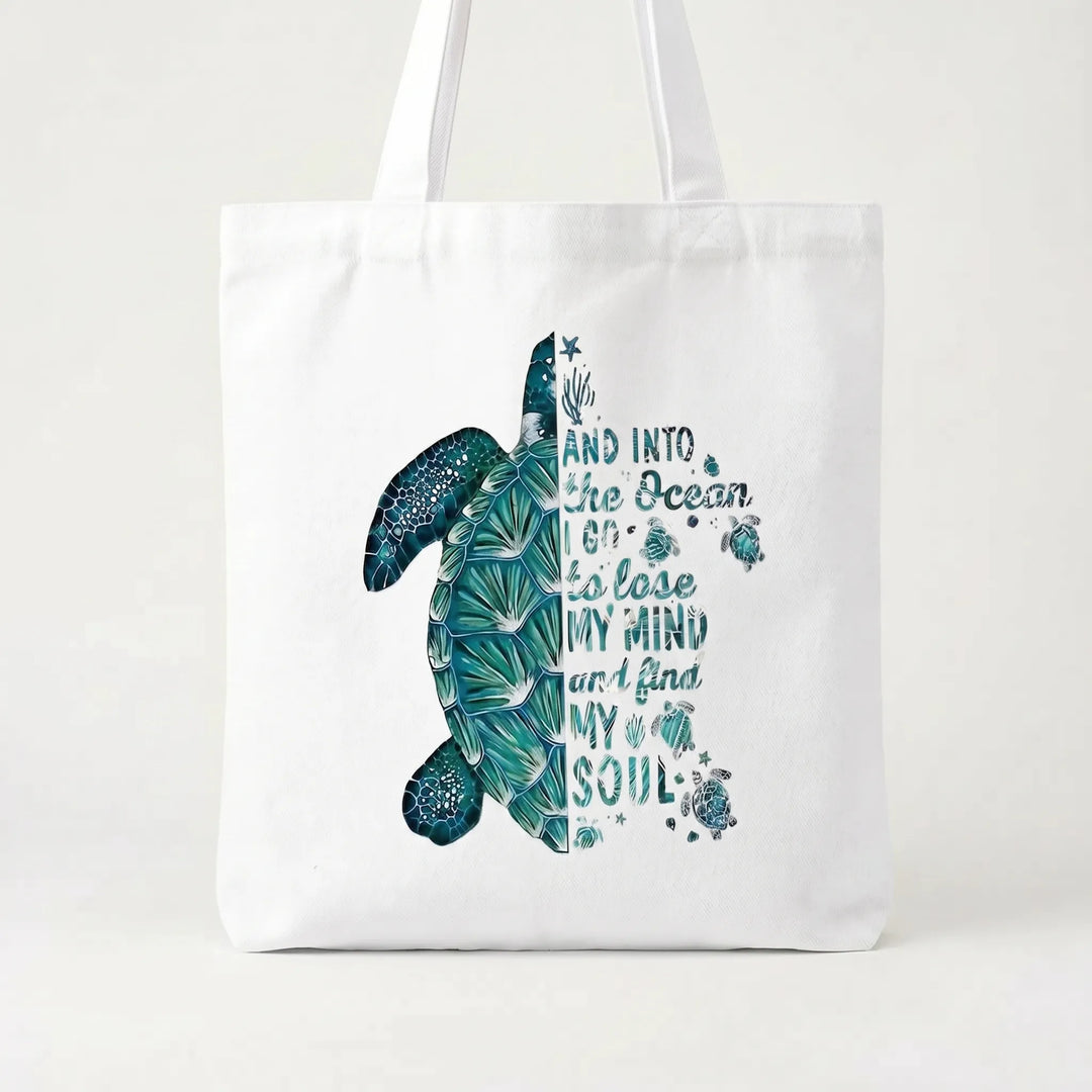 Summer-ready women's tote bag with a tropical hibiscus print. A fashionable and practical shoulder accessory.