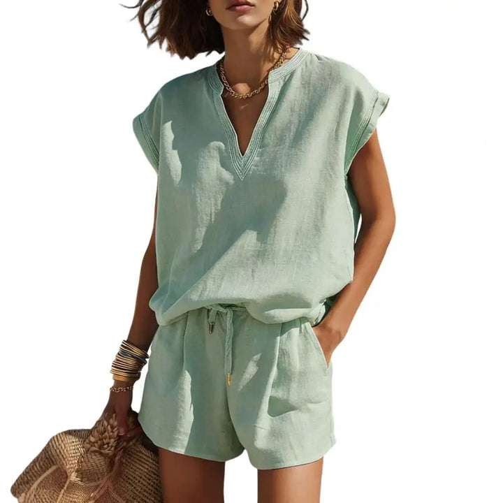 Stylish women's summer co-ord set featuring a V-neck top and comfortable linen-look shorts. Casual outfit.
