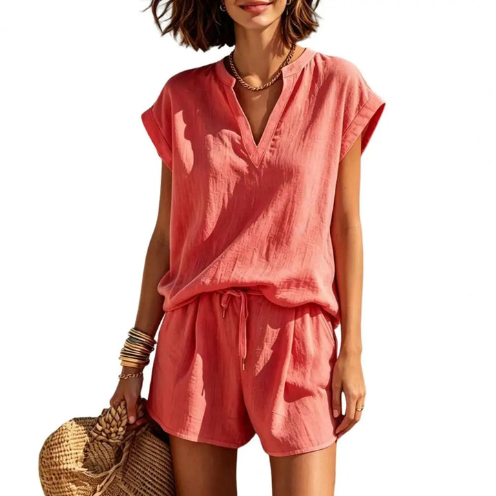 Trendy women's summer co-ord set, featuring a V-neck top & comfortable drawstring shorts. Casual style.