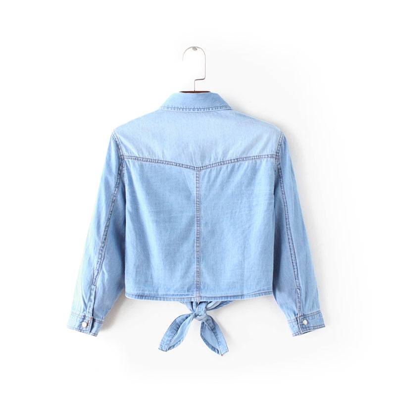 Relaxed fit women's blue tie-front button-up shirt, long sleeve, perfect versatile top for day to night.