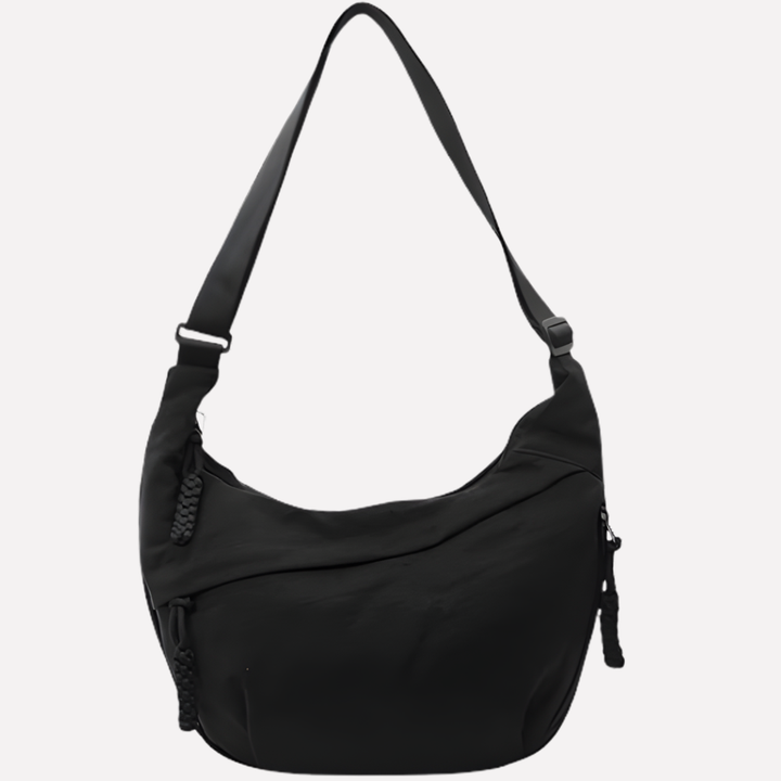 Fashionable women's crescent shoulder bag, featuring a distinctive braided strap. A must-have accessory for any outfit.