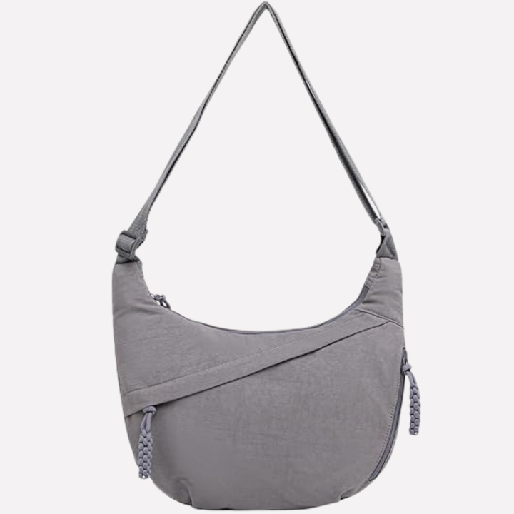 Elegant women's crescent shoulder bag, designed with a sophisticated braided strap. Your go-to fashion purse.