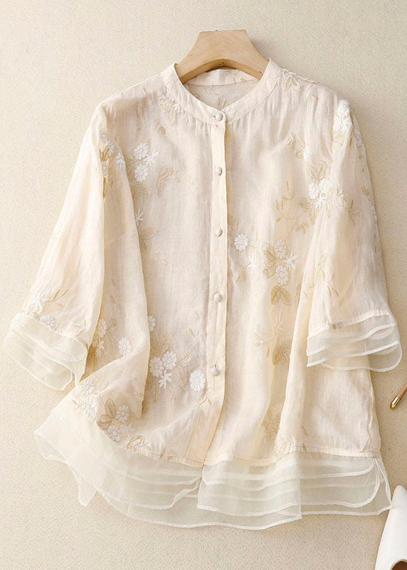 Elegant long-sleeve women's blouse with chic floral print & button details.