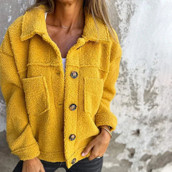 Women's chic lapel collar jacket with button closure, perfect for autumn style.