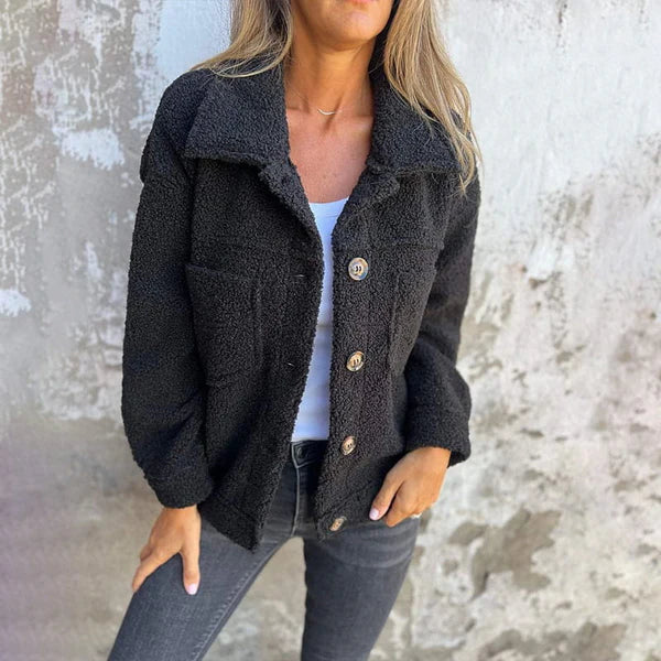 Chic women's lapel collar jacket, short cut, ideal for trendy fall outerwear.
