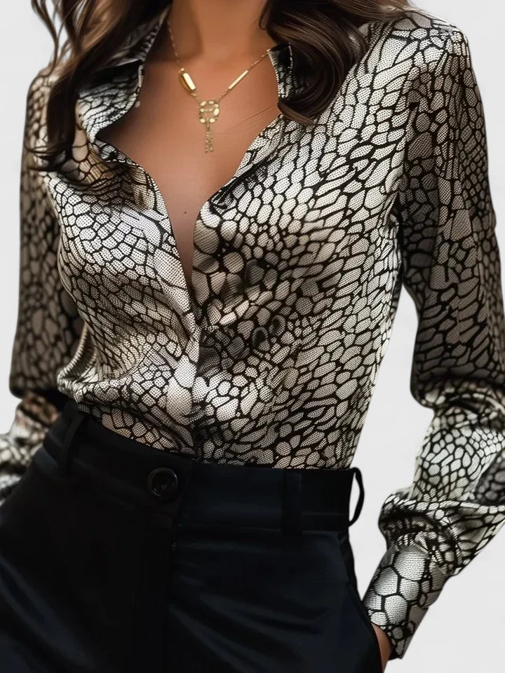 Professional women's leopard print long sleeve button-up blouse. Stylish animal print for workwear.