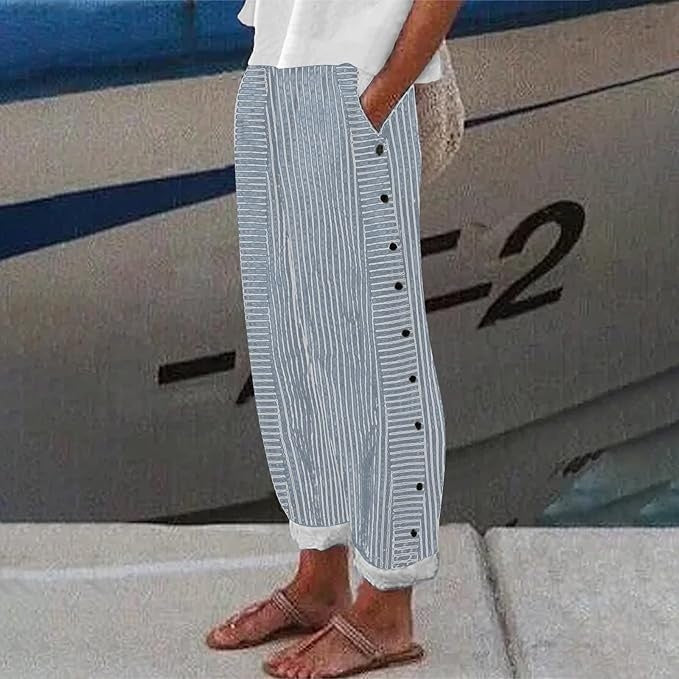 Stylish women's striped trousers, perfect for spring/summer casual chic outfits, featuring button accents.