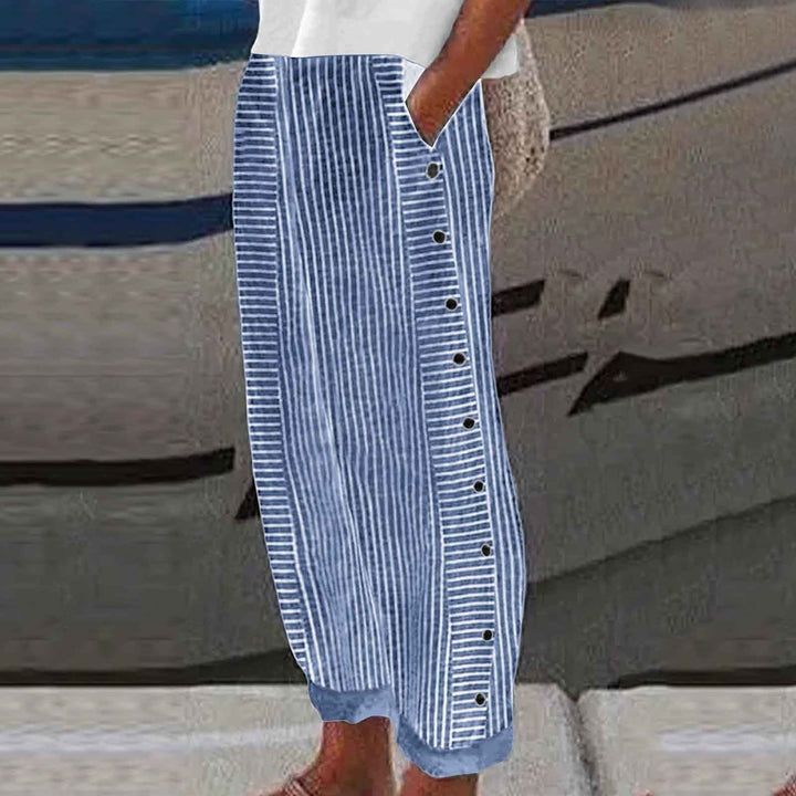 Comfortable women's striped pants with unique button accents, ideal for stylish everyday fashion bottoms.