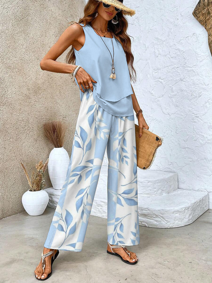 Elegant women's casual chic two-piece outfit for summer. Flowy top, wide-leg pants. Ideal vacation wear.