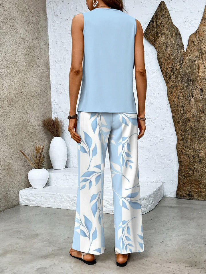 Flowy women's summer two-piece outfit with wide-leg pants and a stylish round-neck top. Casual comfort.