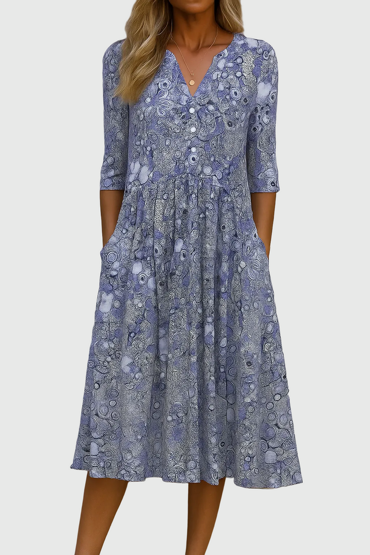 Elegant women's bohemian printed midi dress with V-neckline & button-front detail, ideal for spring & summer.
