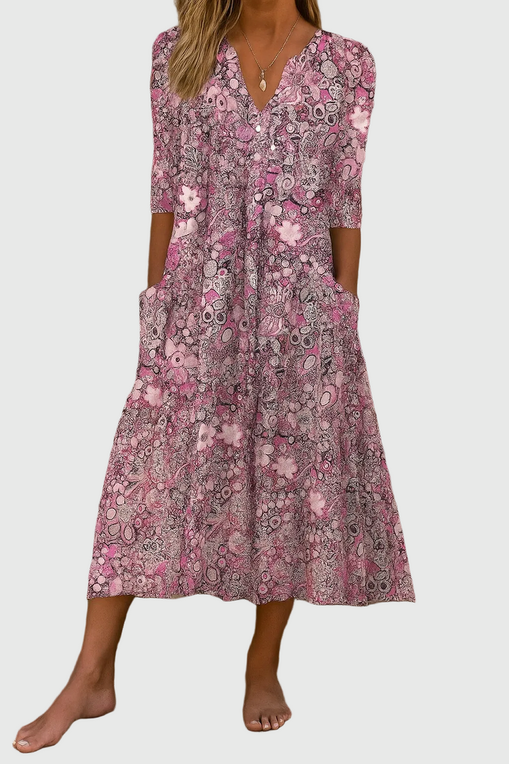 Casual women's flowy V-neck printed midi dress with three-quarter sleeves, great for everyday chic summer style.