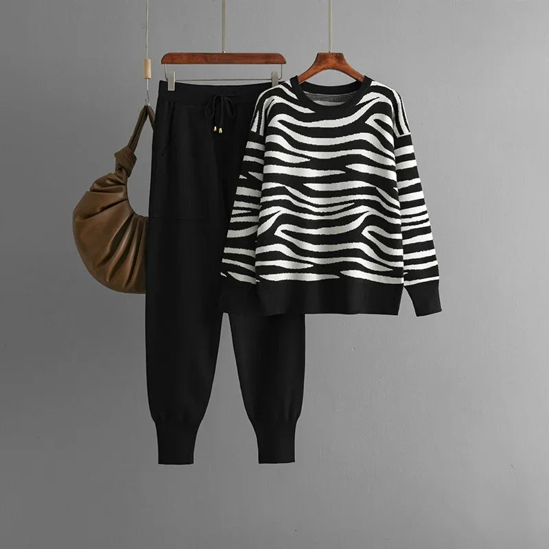 Elegant women's zebra print loungewear, showcasing a comfortable knit sweater and matching joggers.