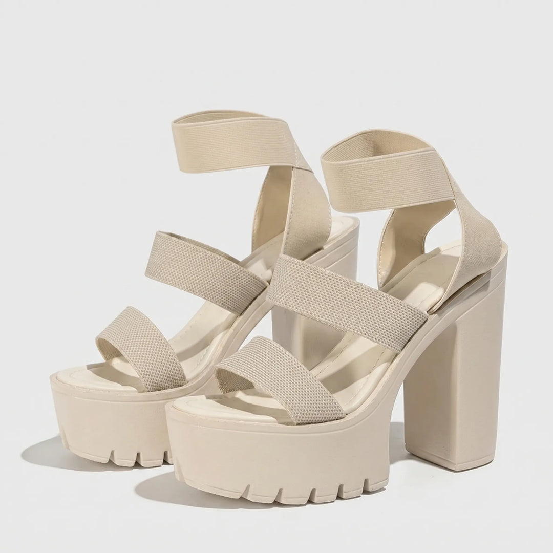 Elevated women's chunky platform sandals featuring a comfortable block heel, ideal for summer fashion.