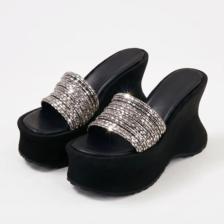 Elegant women's wedge sandals with a chunky platform, providing a comfortable high heel for any occasion.