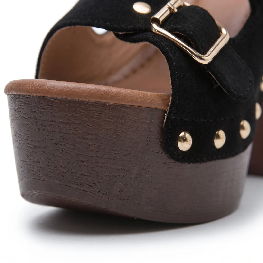Side view of women's elevated platform sandals. Chunky block heel, open toe, and adjustable straps perfect for summer.