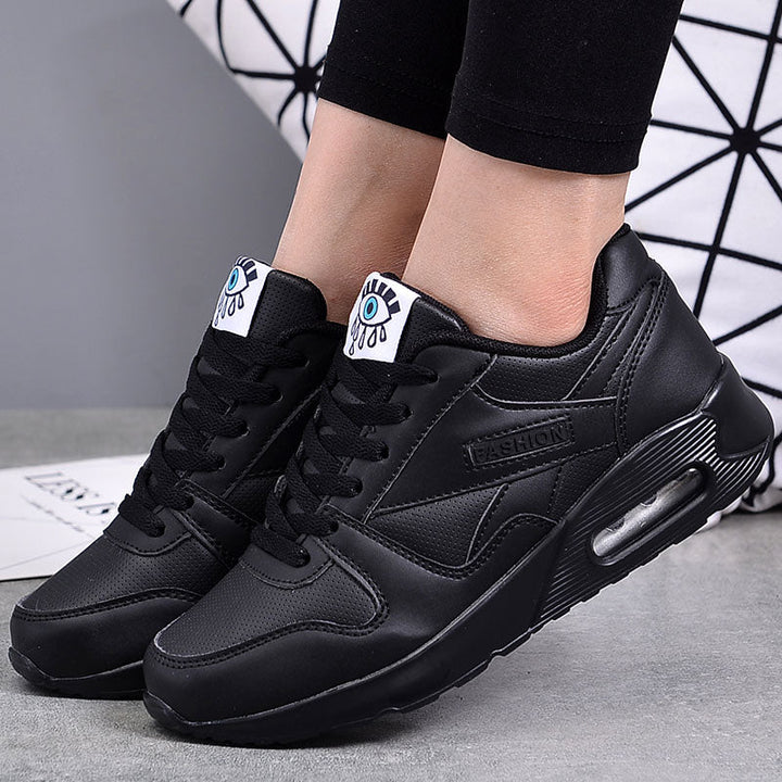 Comfortable women's chunky platform sneakers. Trendy vegan leather footwear for everyday walking.