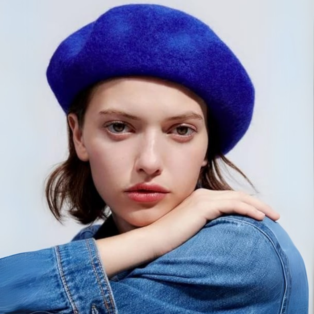 Women's black beret, a timeless French fashion accessory and warm winter hat.