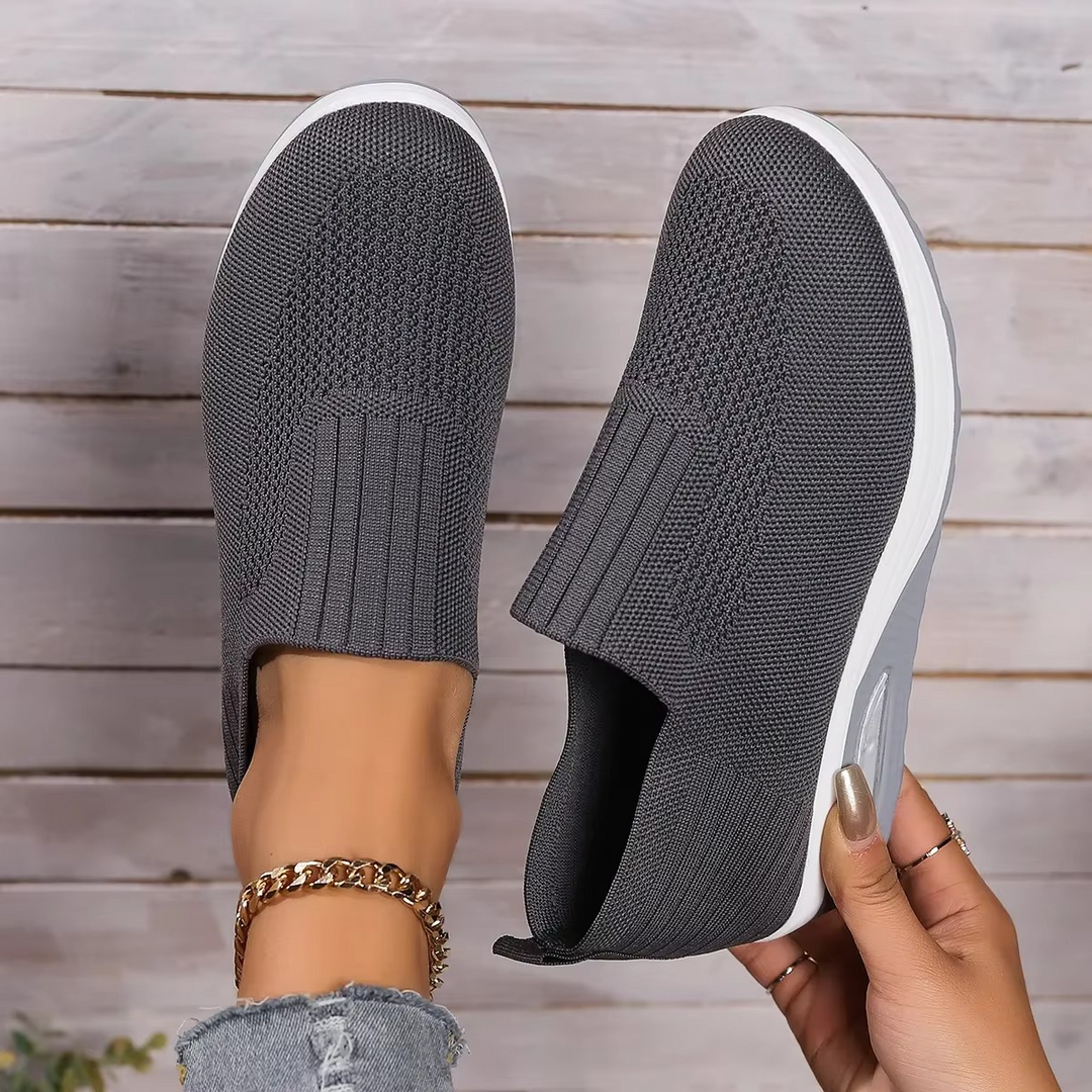 Lightweight women's walking sneakers with orthopedic design and non-slip sole for comfort.