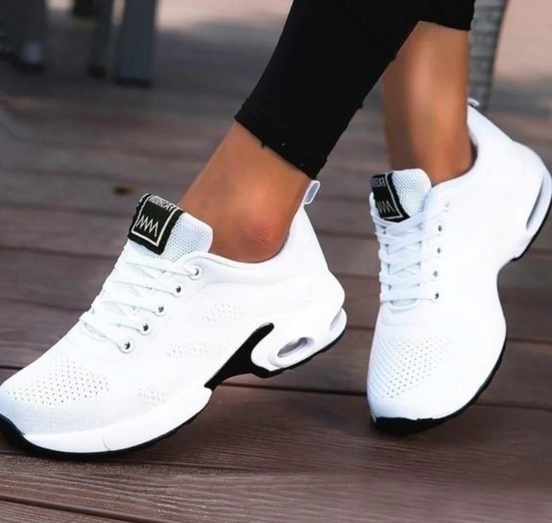 Sporty women's athletic shoes with breathable design, perfect for running, training & daily wear.