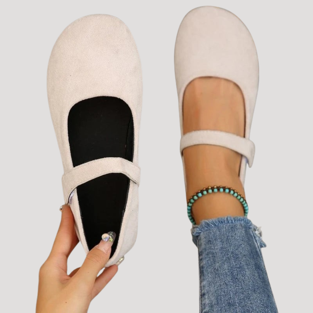 Women's comfortable Mary Jane flats with velcro strap, cushioned support, and round toe for everyday wear.