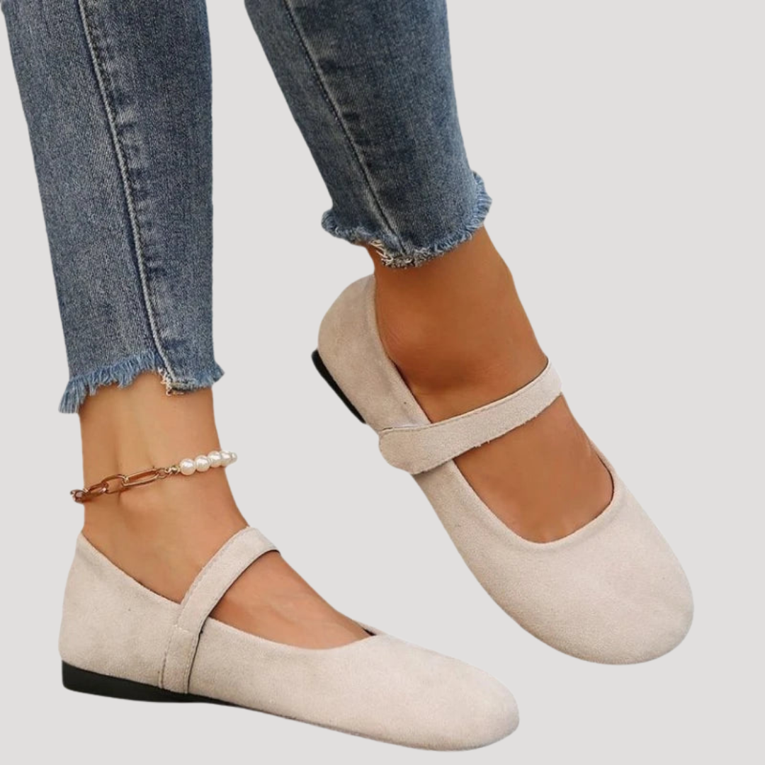 Round toe women's Mary Jane flats, comfortable slip-on style with velcro strap and cushioned support.