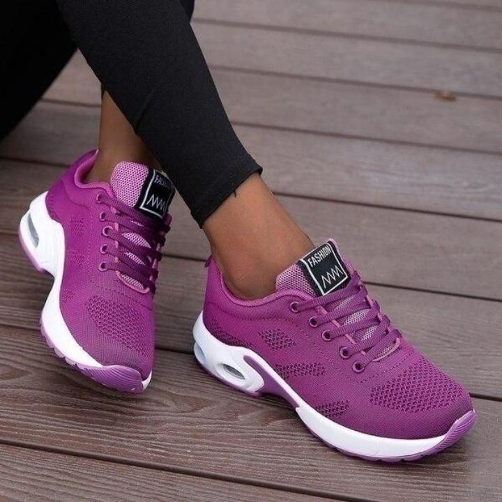 Side profile of lightweight women's athletic footwear, providing ergonomic foot & posture support.