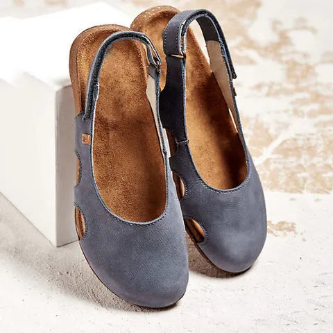 Minimalist women's slingback flats with closed-toe design. Comfortable slip-on footwear for versatile styling.