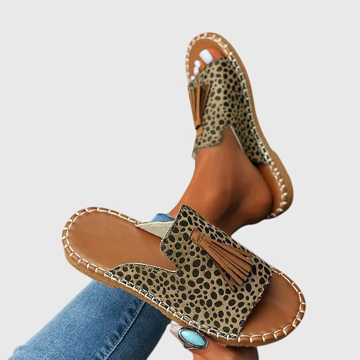 Step into summer with these comfortable women's slip-on sandals, featuring stylish tassel straps.