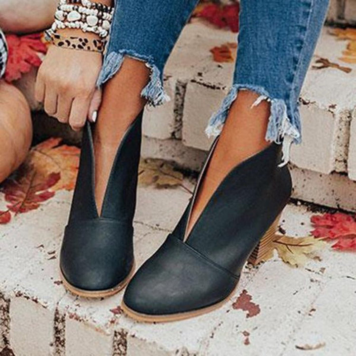 Stylish women's ankle boots with a chic V-cut design. Elegant & comfortable for everyday, fall, and winter fashion.