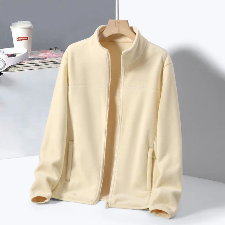 Warm women's fleece jacket, lightweight outerwear with a high collar and zippered pockets for casual wear.