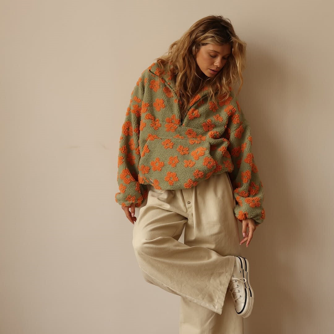 Casual floral sherpa fleece sweater for women. Oversized, cozy, and warm, ideal for fall/winter layering.