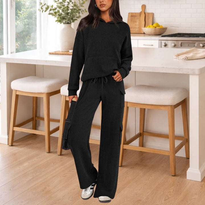 Stylish women's knit comfort set with a soft hoodie and flowing wide-leg pants, perfect for home.