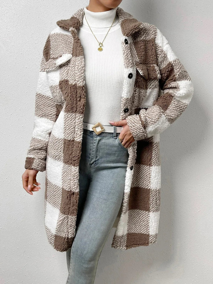 Women's warm plaid long coat with button closure. Cozy longline jacket, perfect winter outerwear.