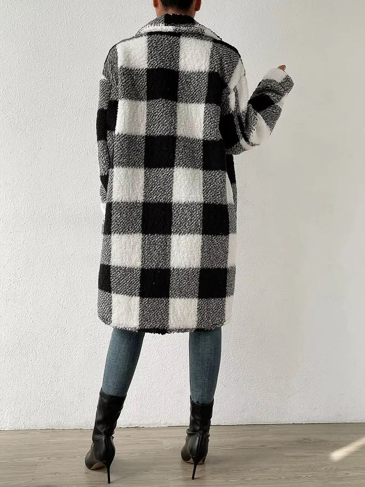 Ladies' plaid button-up jacket with stand collar. Cozy longline design for ultimate winter warmth.