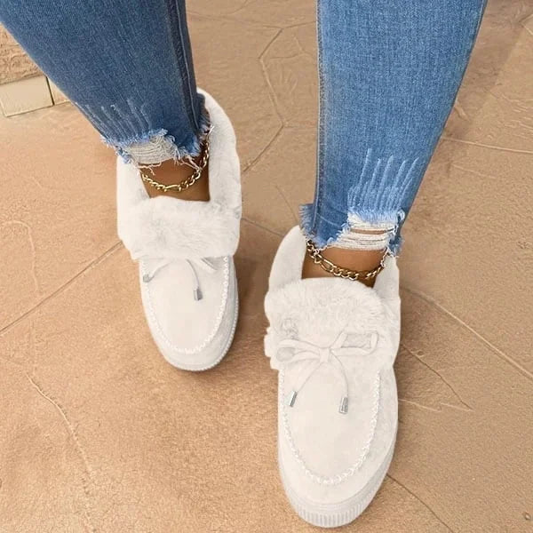 Comfortable women's round-toe slip-on shoes. Cozy cotton footwear, ideal for warm winter and casual fashion.